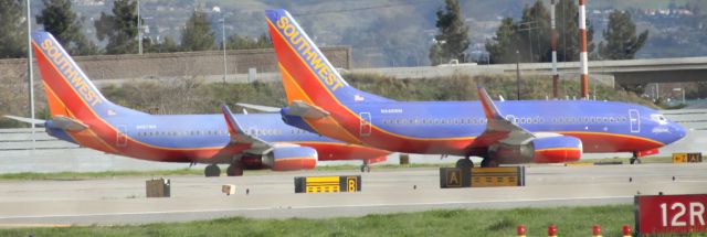 Boeing 737-700 — - A pair of B737, await Take Off clearance near 30-L