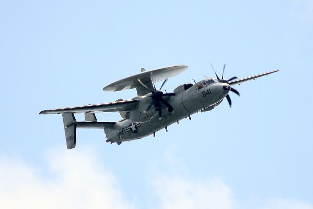 — — - U.S. Navy Grumman E-2C-II Hawkeye participating in The War of 1812 Bicentennial Celebration over Boston Harbor.
