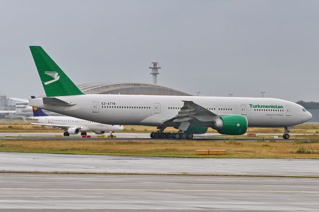 Boeing 777-200 (EZ-A778) - date 05-Jul-2017, departure on a dreary day via RWY18 to Ashgabat (ASB) as flight T5 464