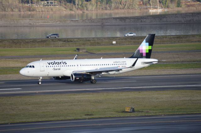 Airbus A320 (N518VL) - "Sarai" operating as VOI5938 arriving on 28R from MMGL/GDL.