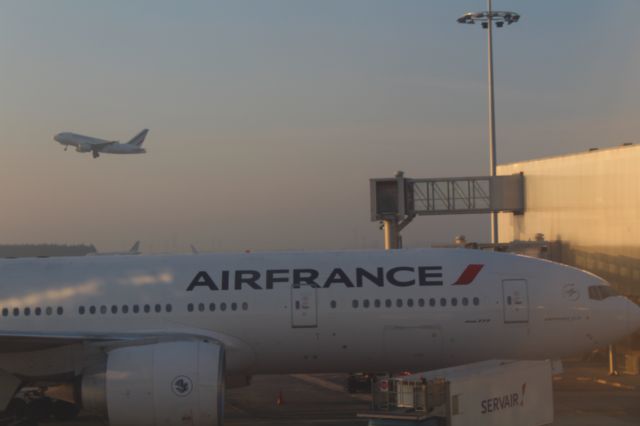 Boeing 777-200 (GSPK) - Air France 777 with plane taking off behind