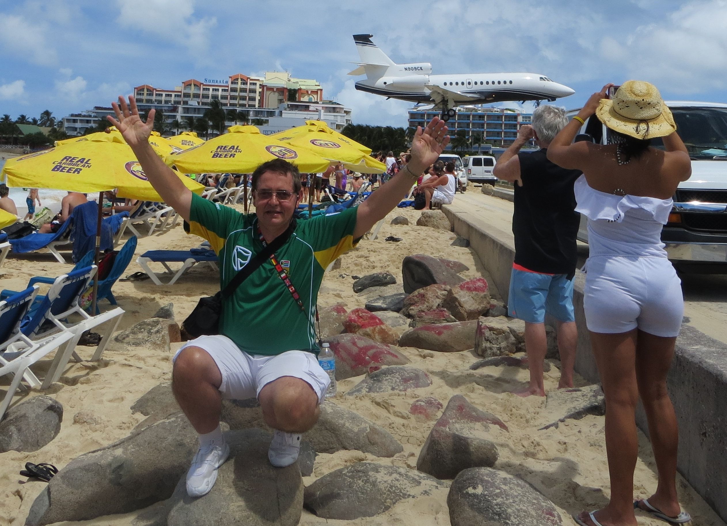 Dassault Falcon 900 (N909CK) - Balancing a Dassault Falcon 900 on my middle finger at Maho Beach, St Maarten, while cheering for our South African Protea Cricket team!