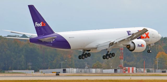 Boeing 777-200 (N879FD) - FedEx 777 landing on center at Memphis International Airport