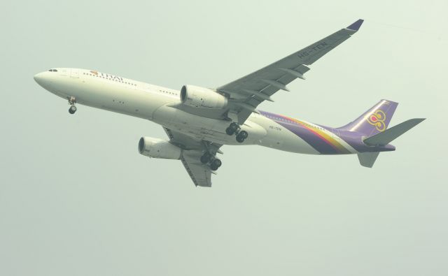 Airbus A330-300 (HS-TEN) - Thai Airways HS-TEN Landing approach at Yangon Airport(RGN/VYYY)during misty condition. if you enlarge the photo you can see vapour trail behind the winglet.