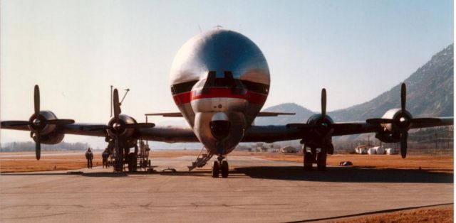 N422AU — - Erickson Boeing Straocruiser Guppy at Penticton Canada CYYF - Brought Skycrane S64 helicopter to remove another helicopter from a mountain. 1990