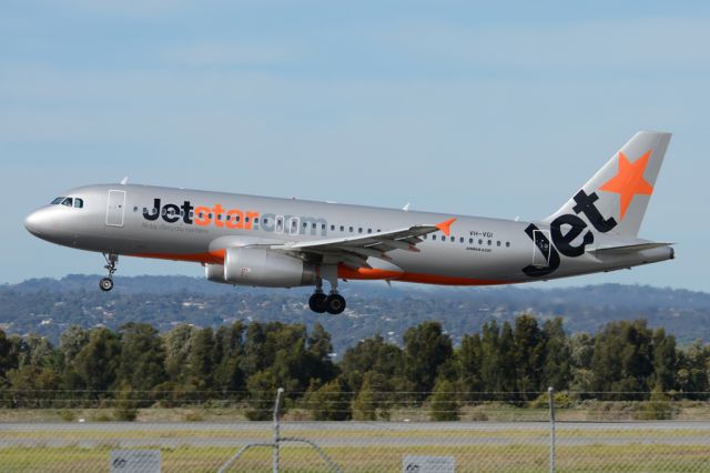 Airbus A320 (VH-VGI) - About to put down on runway 05. Thursday, 8th May 2014.