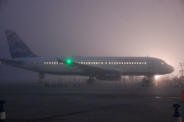 Airbus A320 (N583JB) - Predawn fog at the LGB JetBlue flight line on December 5th, 2012