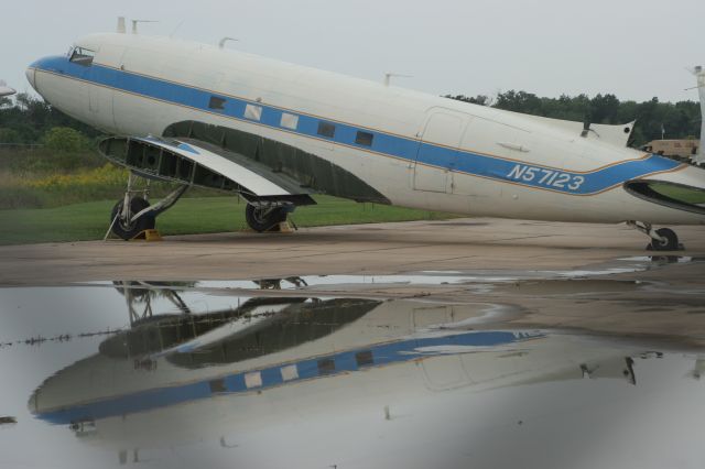 — — - DC-3 in the Rain