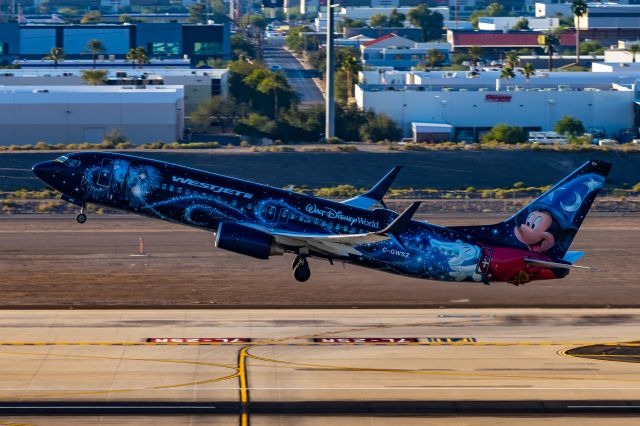 Boeing 737-800 (C-GWSZ) - WestJet 737-800 in Sorcerer Mickey special livery taking off from PHX on 11/13/22. Taken on a Canon R7 and Tamron 70-200 G2 lens.