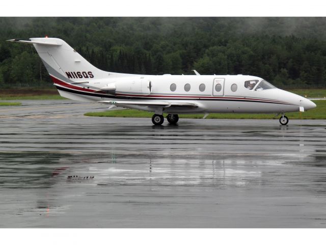 Beechcraft Beechjet (N116QS) - Netjets landing in lousy weather at LEB. Nice people at the FBO.