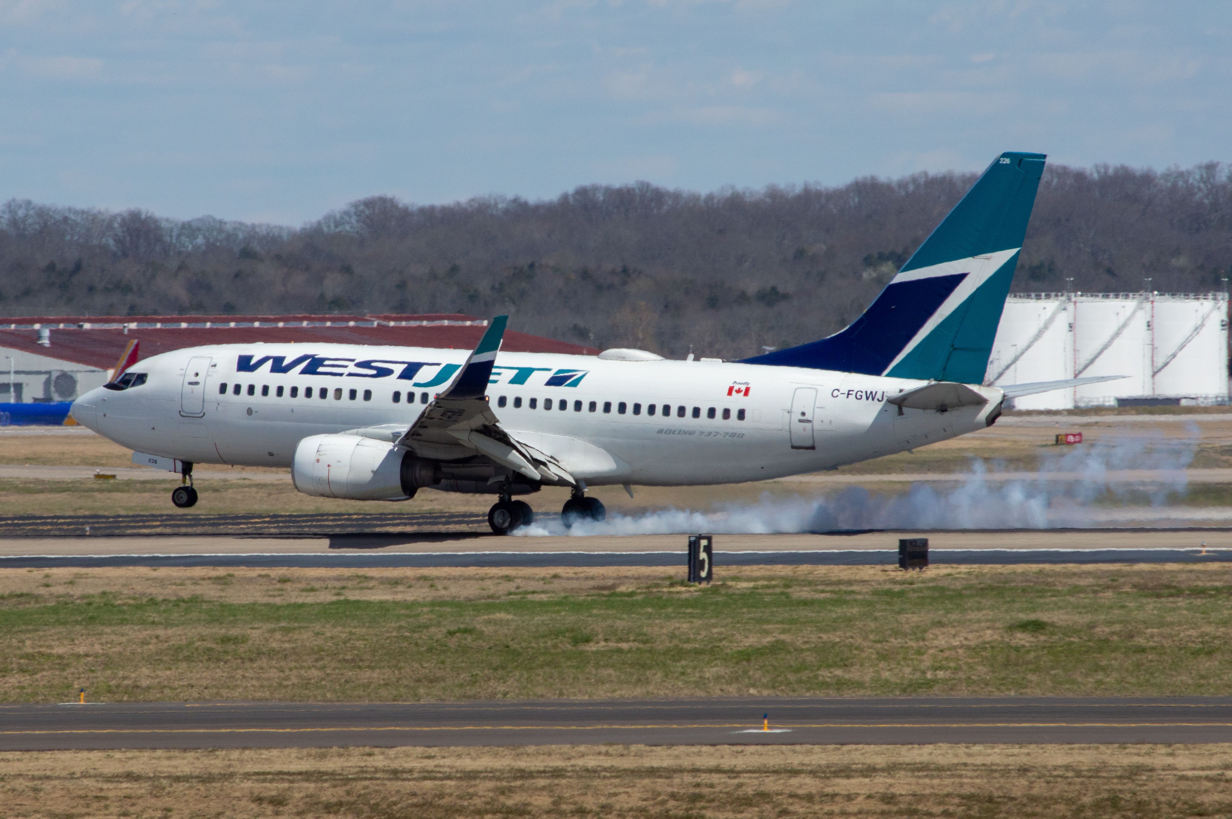 Boeing 737-700 (C-FGWJ) - WestJet is arriving into Nashville from Calgary CYYC on Runway 2L at 2:35 PM on March 18, 2019. This was the first time I have seen a WestJet aircraft. Shot on Nikon D3200 at 200mm.