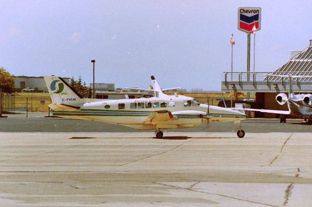 Beechcraft Airliner (C-FVCM) - CYVR - Pacific Coastal Beech Airliner headed out to the runways, Aug mid 1990s