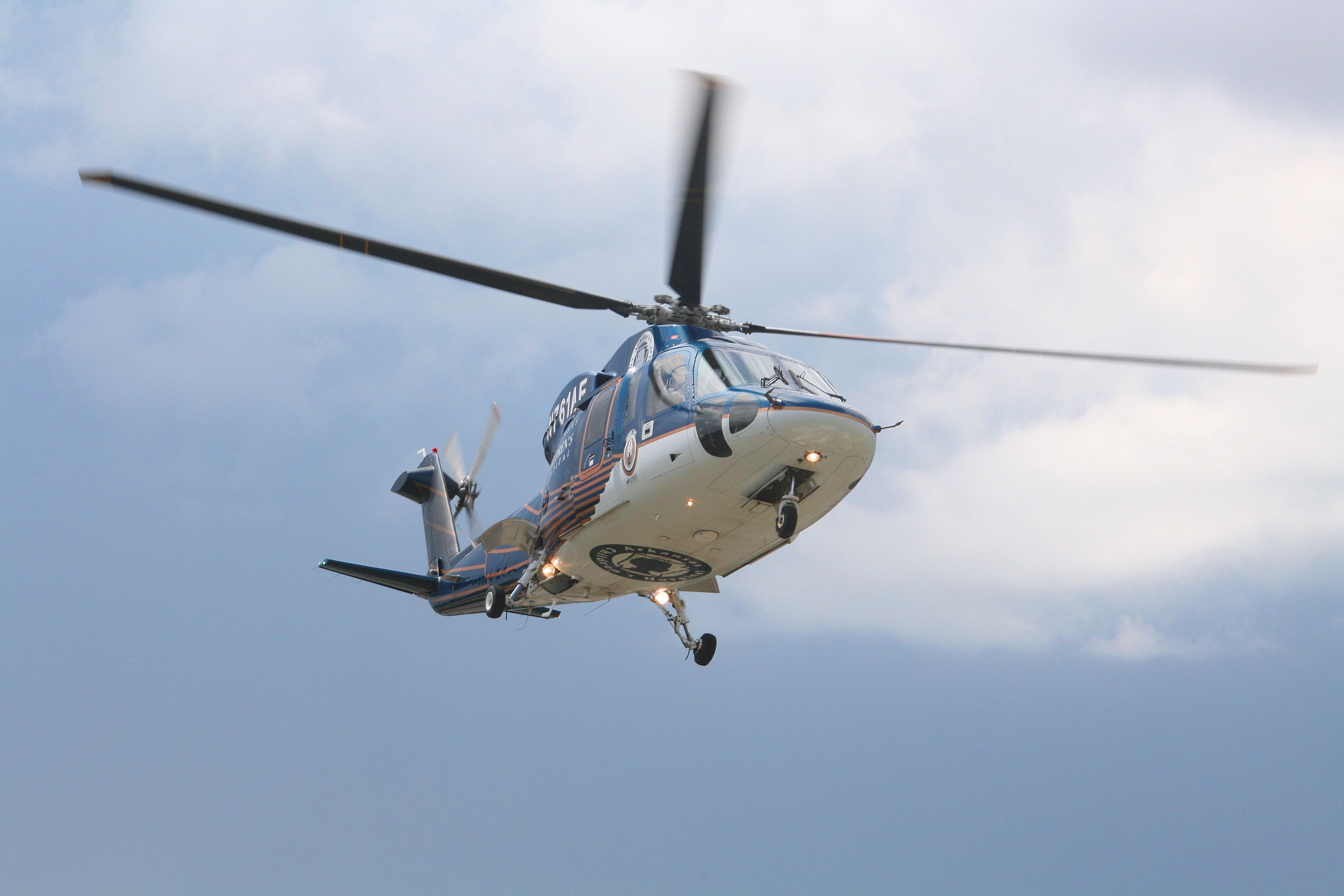 Sikorsky S-76 (N761AF) - Angel Flight One lifts off on a stormy day from St. Edward Mercys helipad for Arkansas Childrens Hospital in Little Rock. Special thanks to the pilot who hovered for a few seconds to give me some great photos.