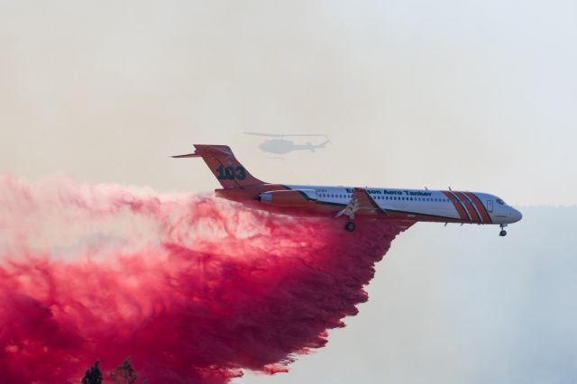 McDonnell Douglas MD-87 (N293EA) - Tanker 103 dropping retardant on a fast moving brush fire only 1 mile West of MFR.