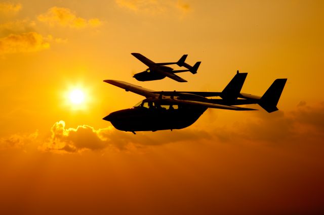 — — - Air to air shoot with 2 x Cessna 337s during an African sunset. Aircraft tail numbers ZS-EEM and ZS-PKL.