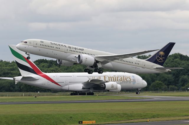 Boeing 787-9 Dreamliner (HZ-AR11) - Neighbours. EK17 arrives from Dubai as the recently delivered HZ-AR11 departs to Jeddah as SVA124