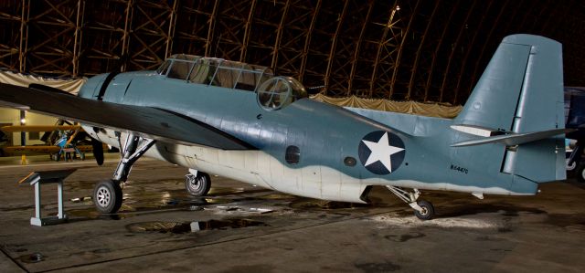 Grumman G-40 Avenger (N6447C) - Grumman TBM-3 "Avenger." Hangar curtains closed* to keep daylight from creating shadows. Flash also intentionally disabled for the same reason. Only lighting used was the interior lights inside the hangar. * Thanks to TAM staff for closing curtains long enough for me to take my pictures. *br /This is the first picture of N6447C to be posted into the FA photo gallery.br /br /To learn more about this aircraft, click on the link below ....br /br /a rel=nofollow href=http://www.warbirdregistry.org/avengerregistry/avenger-53575.htmlhttp://www.warbirdregistry.org/avengerregistry/avenger-53575.html/a