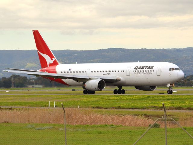 BOEING 767-300 (VH-ZXC) - On taxi-way heading for take off on runway 05, for flight to Sydney. Thursday 12th July 2012.