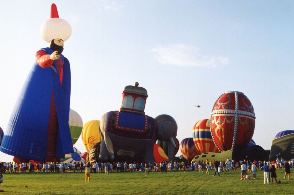 Unknown/Generic Balloon (G-TURK) - ALEXANDRIA AIRPORT-PITTSTOWN, NEW JERSEY, USA-Circa early 1990s: Seen at the Magic of Alexandria Balloon Festival were three of the many special shaped hot air balloons belonging to the late Malcolm Forbes, publisher of FORBES magazine. Pictured, from left to right are: "Suleyman the Magnificient-registration number G-TURK, the "Thailand Elephant" registration number G-BLRW and the "Faberge Rosebud Egg" registration number G-BNFK. The balloons of Malcolm Forbes were often seen at the balloon festivals in his home state of New Jersey and were specially made for him by Cameron Balloons for his good will tours to various countries.