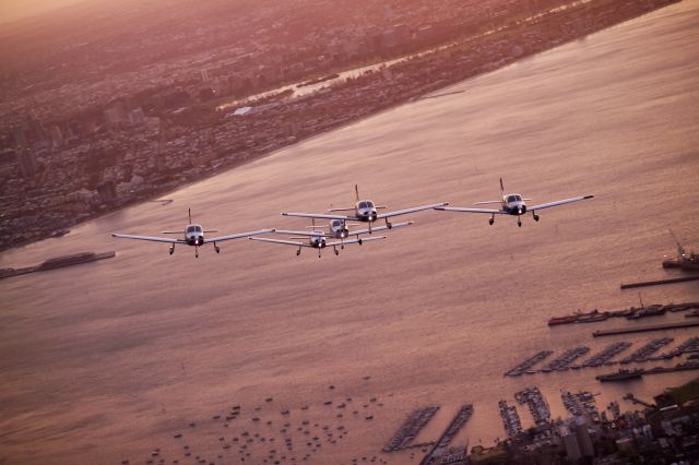 Piper Cherokee (VARIOUS) - Battle of Britain Dawn Patrol, every Sept, taken by Photographer with the back door off from my Piper Lance.  Communications critical part of the process