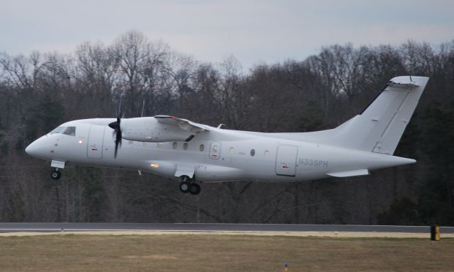 Fairchild Dornier 328 (N335PH) - Departing runway 02 - 1/12/10