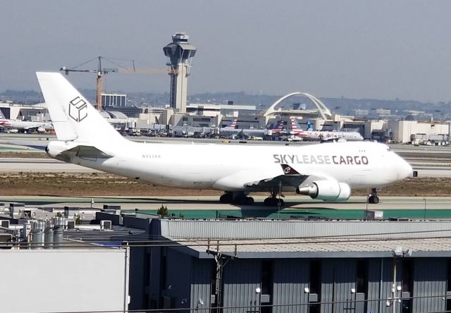 N903AR — - The white SkyLease Cargo 744F makes a long rollout/taxi photo opportunity @ LAX 25L.