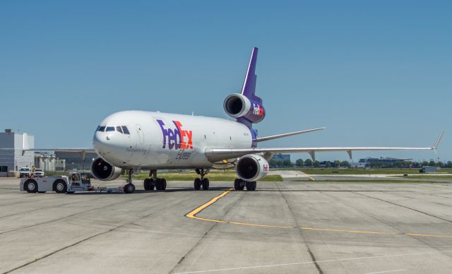 Boeing MD-11 (N590FE) - Tug practice! This Fedex MD11 was pushed and pulled for some time as the ramp guys tried for their tug license