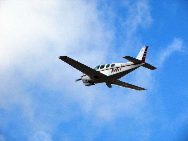 Beechcraft Bonanza (36) (N49LF) - Taking off RWY 26L