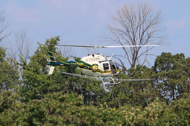 — — - A surprise catch on the way back from Camp Perry in Port Clinton, OH. I saw this Ohio Department of Natural Resources Bell 206B, N500NR, C/N 3049, State Route 2 just east of Sandusky Bay near Bay View, Ohio, USA. I pulled off, waited for another pass, and snapped a few shots.