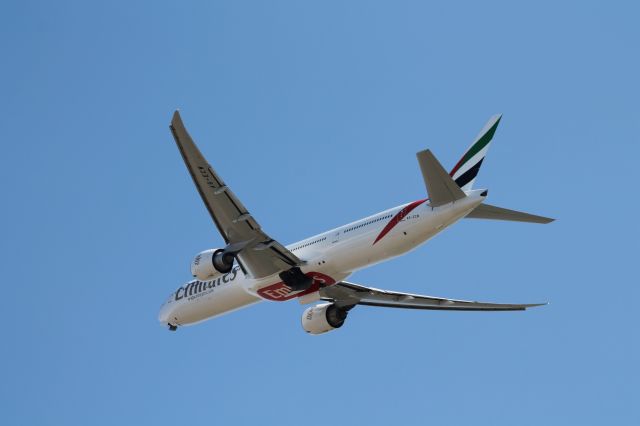 BOEING 777-300 (A6-ECW) - First heavy catch of the day. Emirates Boeing 777-300ER leaves 4R at Logan for an 11 hour trip to Dubai, United Arab Emirates.