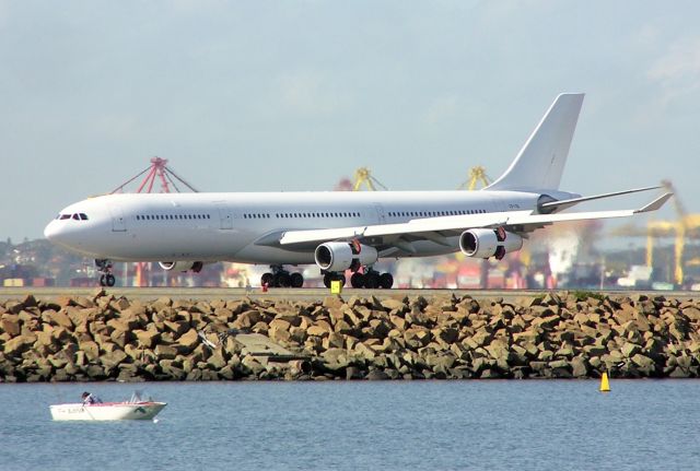 CS-TQL — - This A340 in all white it is on charter from  HiFly Portugal it's in Sydney Australia doing service for the Australian Defence Force it sure stands out from the other aircraft on Friday 08/06/2012.br /MSN-133 Also a EX Gulf Air A9C-LF