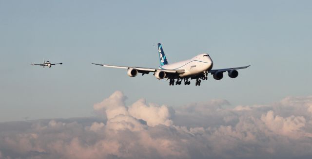 BOEING 747-8 (N747EX) - Boeing 747-8F on short final with Boeings T-33 chase plane after completing a successful maiden flight