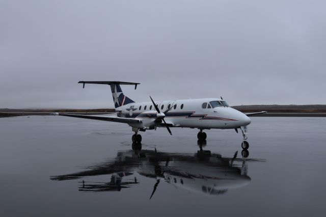 Beechcraft 1900 (N125AX) - Fuel stop. Parked off of runway 8-26, taxi A and B.