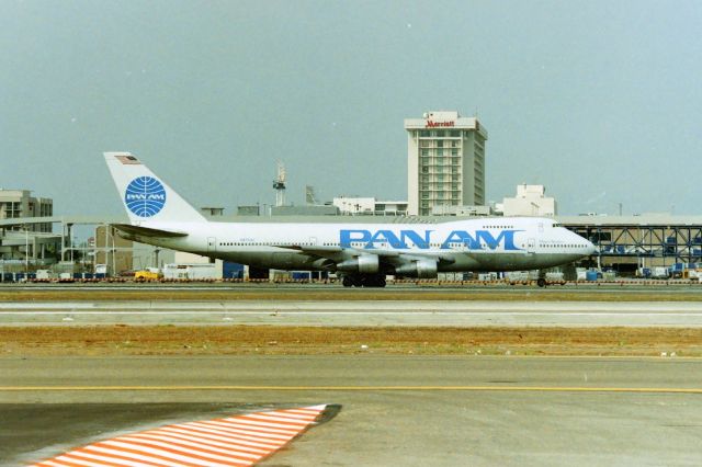 Boeing 747-200 (N4703U) - KLAX - "Clipper Nautilus" on the slow taxi to Runway 25R for departure. March 1989. THis jet delv new to United in 1970. Pan Am bought this in July 1986. CN: 19753 LN: 62.