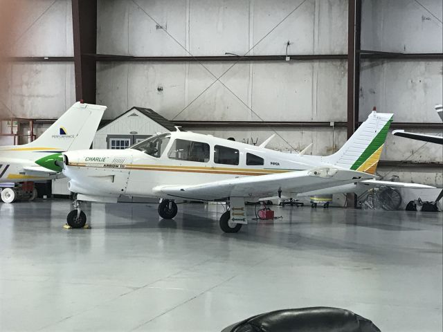 Piper Cherokee Arrow (N777CD) - This airplane was getting charged up in the Silverhawk Hangar 1