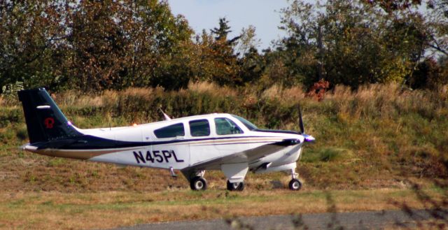 Beechcraft Bonanza (33) (N45PL) - Taxiing for departure is this 1987 Beechcraft Bonanza F33A in the Autumn of 2021.