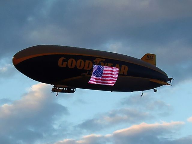 — — - Dusk shot of Good Year Blimp 