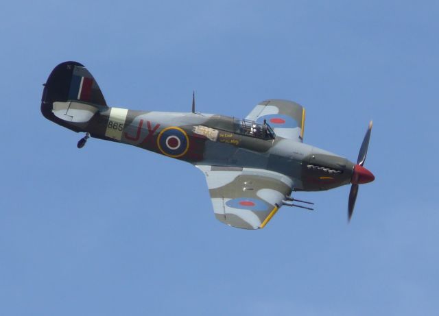 PZ865JX — - 2009 during the RAFA Air Show at Shoreham Airport.From the garden of a friends house close to Lancing College on the hill so I was literally at the same altitude of many of the planes.br /1944 This was the last Hurricane built. Flew in the Kings Cup Air race in 1950 and flown by Gp Capt Peter Townsend. Now with the Battle of Britain Memorial Flight.