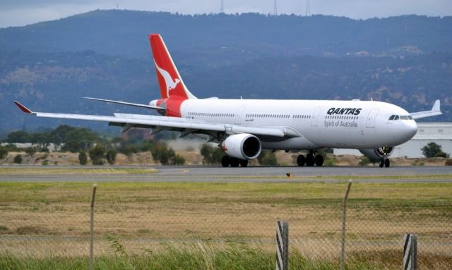 Airbus A330-300 (VH-QPD) - Turning from runway 23 on to taxi-way, on arrival from Sydney en-route to Singapore. Tuesday 27th December 2011.