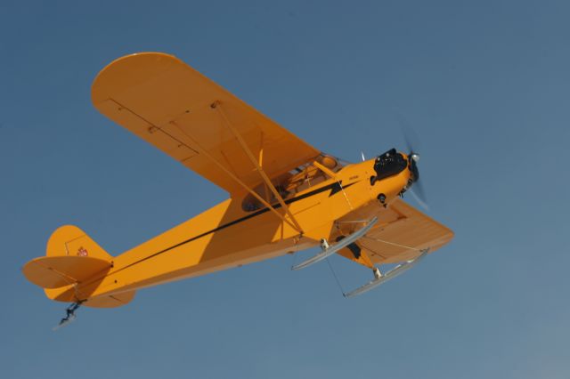— — - Piper Cub on Skis at Oshkosh, WI