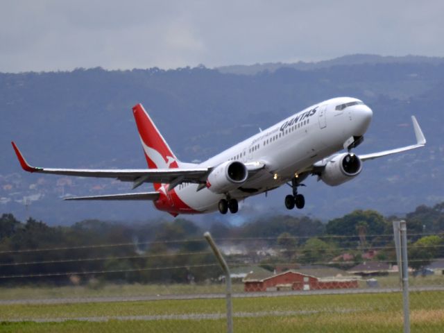 Boeing 737-800 (VH-VZB) - Getting airborne off runway 23.