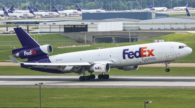 Boeing MD-11 (N591FE) - Left main just touching down.