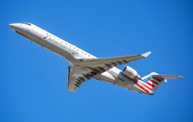 Canadair Regional Jet CRJ-700 (N505AE) - Taking off on a crystal clear afternoon from CLT.