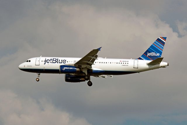 Airbus A320 (N590JB) - JetBlue, N590JB, Airbus A320-232, on approach into Tampa, Florida.  Photo by John A. Miller, a rel=nofollow href=http://www.photoenrchments.comwww.photoenrchments.com/a