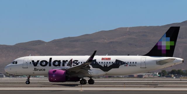 Airbus A320neo (N532VL) - VOI's newest special stickers, "Batman," are on N532VL. The port side design, a large bat and a small Batman figure, is visible here as N532VL taxies north to the terminal. The starboard side design is different.br /The air temperature when this snap was clicked was 102 degrees F. The temp out on the runway and taxiways where I was positioned was 128 degrees F. The temp continued to go up and a new record temperature (for September) occurred at the airport when the mercury hit 106 degrees F air temp about two hours after this photo was taken.