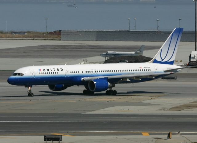 Boeing 757-200 (N554UA) - KSFO 4/1/2005 shows UAL 757 rolling off 28R for the gate!