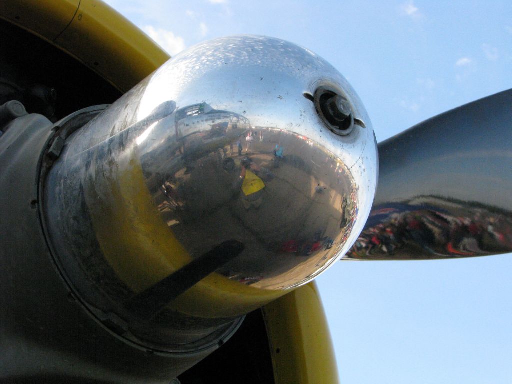 — — - Reflection of pilot on spinner of B-25J Bomber