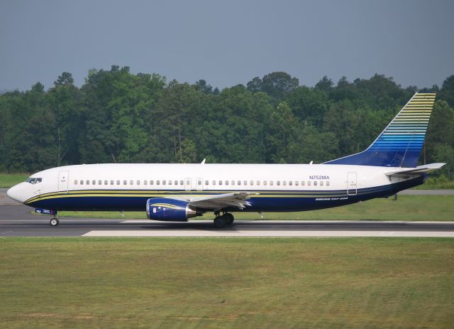 BOEING 737-400 (N752MA) - Rolling runway 20 for CVG with NASCAR teams headed for Kentucky Motor Speedway - 7/6/11