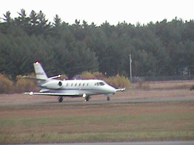 Cessna Citation Excel/XLS (N905AC) - Arriving from GA on 10/22/13. Taxiing on runway 32 due to ramp construction.