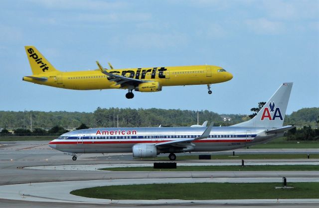 Airbus A321 (N660NK) - 6/14/23 Spirit inbound for Rwy 17R as AA N921NN waits to depart